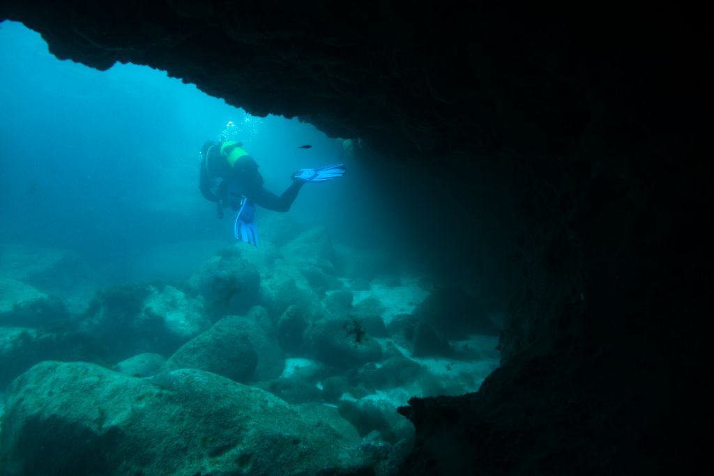 Divers in underwater cave